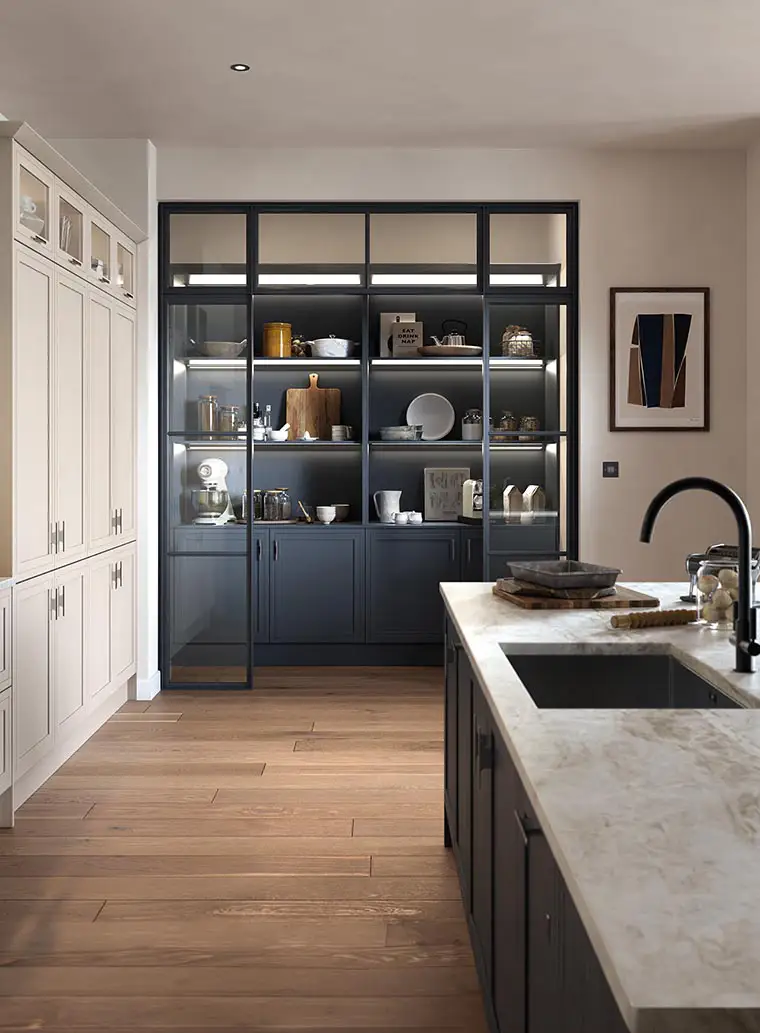 Dark blue open shelf units for the kitchen with stone effect quartz worktop.
