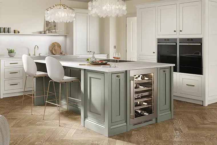 Inframe beaded shaker kitchen in dove grey and regiment green with brass cup and knob handles.