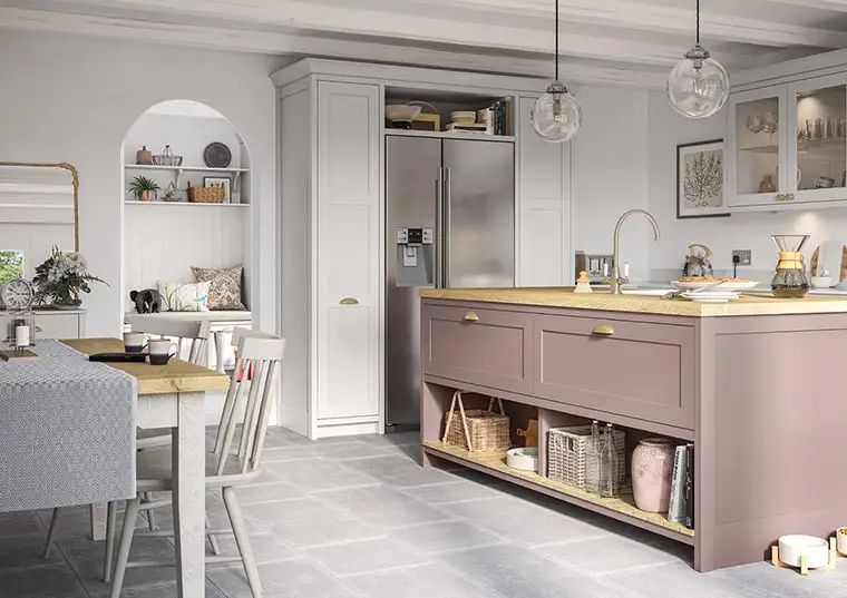 Shaker style kitchen in vintage pink and light grey with solid oak worktops. James-Young Kitchens & Interiors, Frome, Somerset.